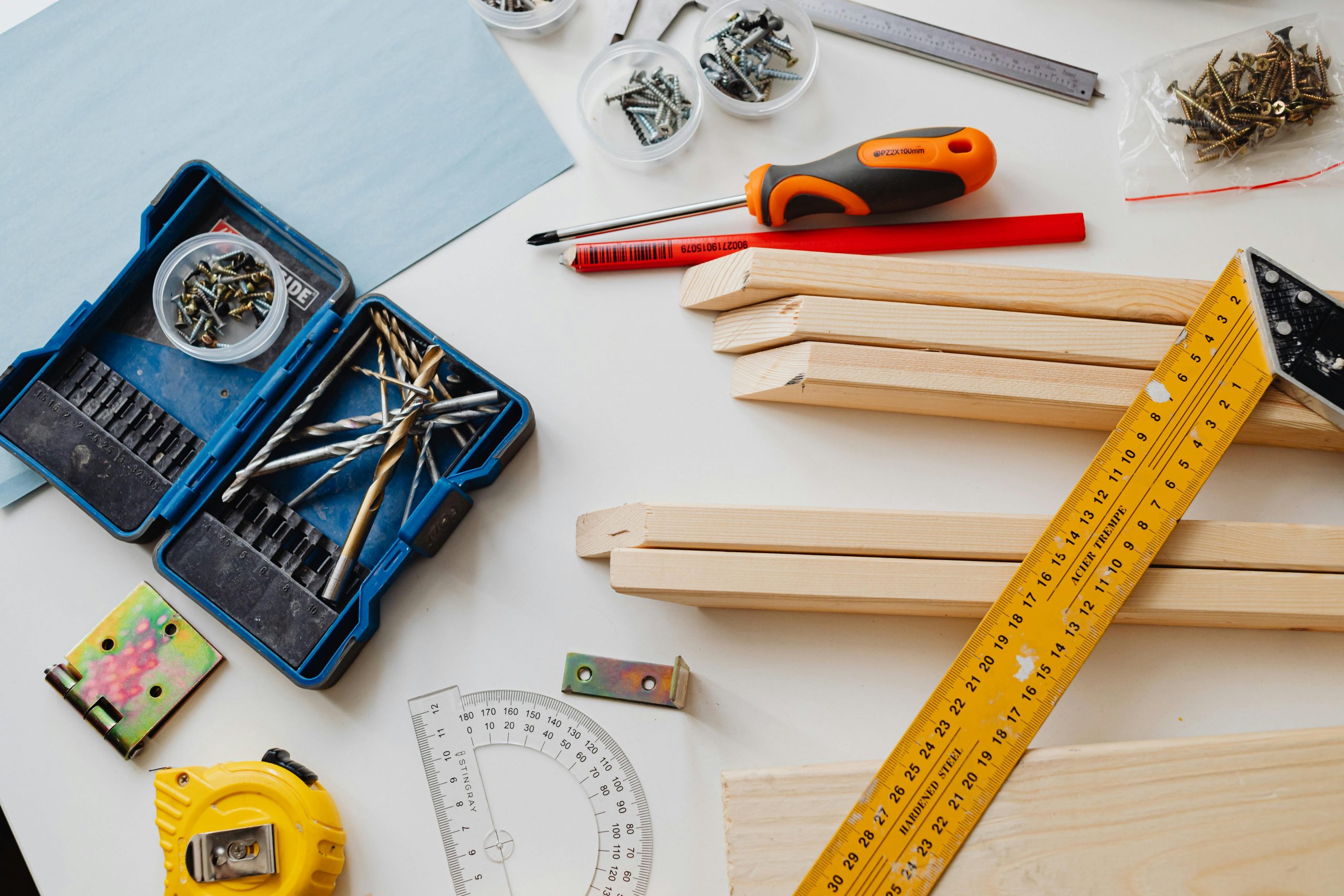 wood, screwdrivers, measuring tape, and various DIY tools