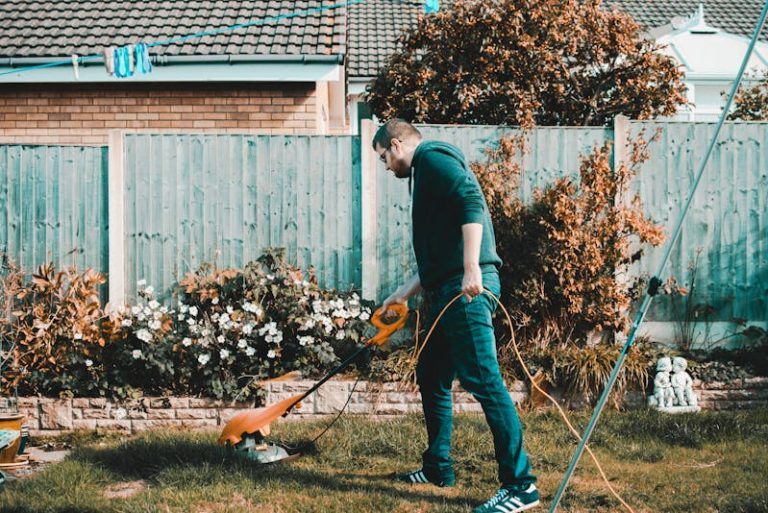 a man tending his lawn and landscaping